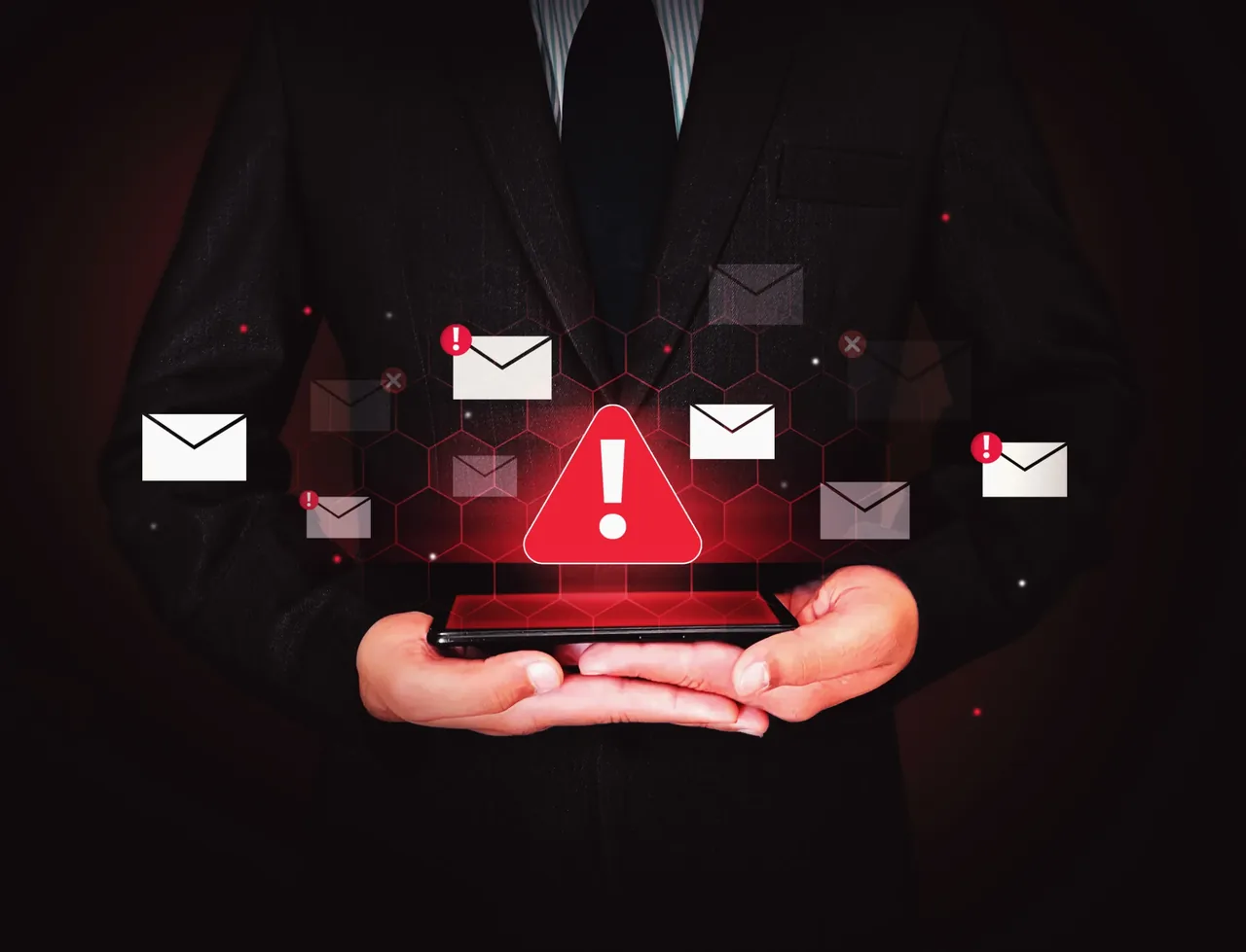 Business professional holding a smartphone surrounded by red warning alerts, representing delayed emergency response in traditional security systems