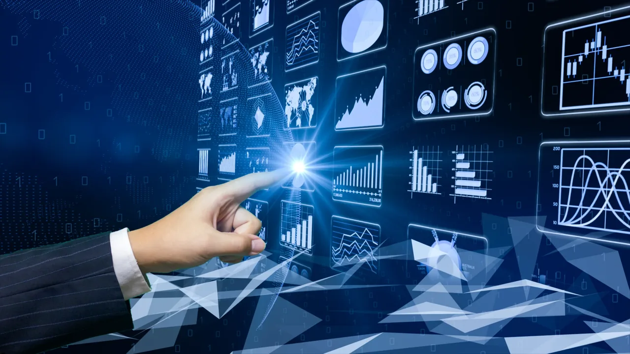 Hand reaching towards a large illuminated wall of security data dashboards, charts and analytics visualisations